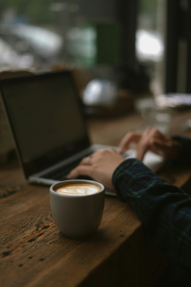 Coffee and a laptop ready for a working conversation